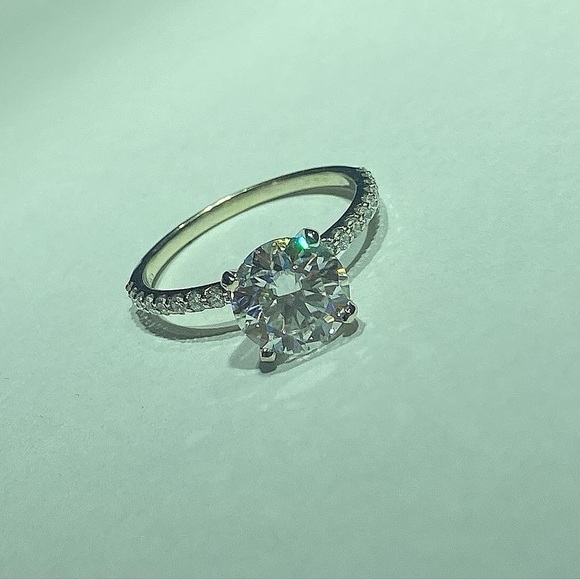 beautiful 14k gold Diamond band with a Moissanite center
